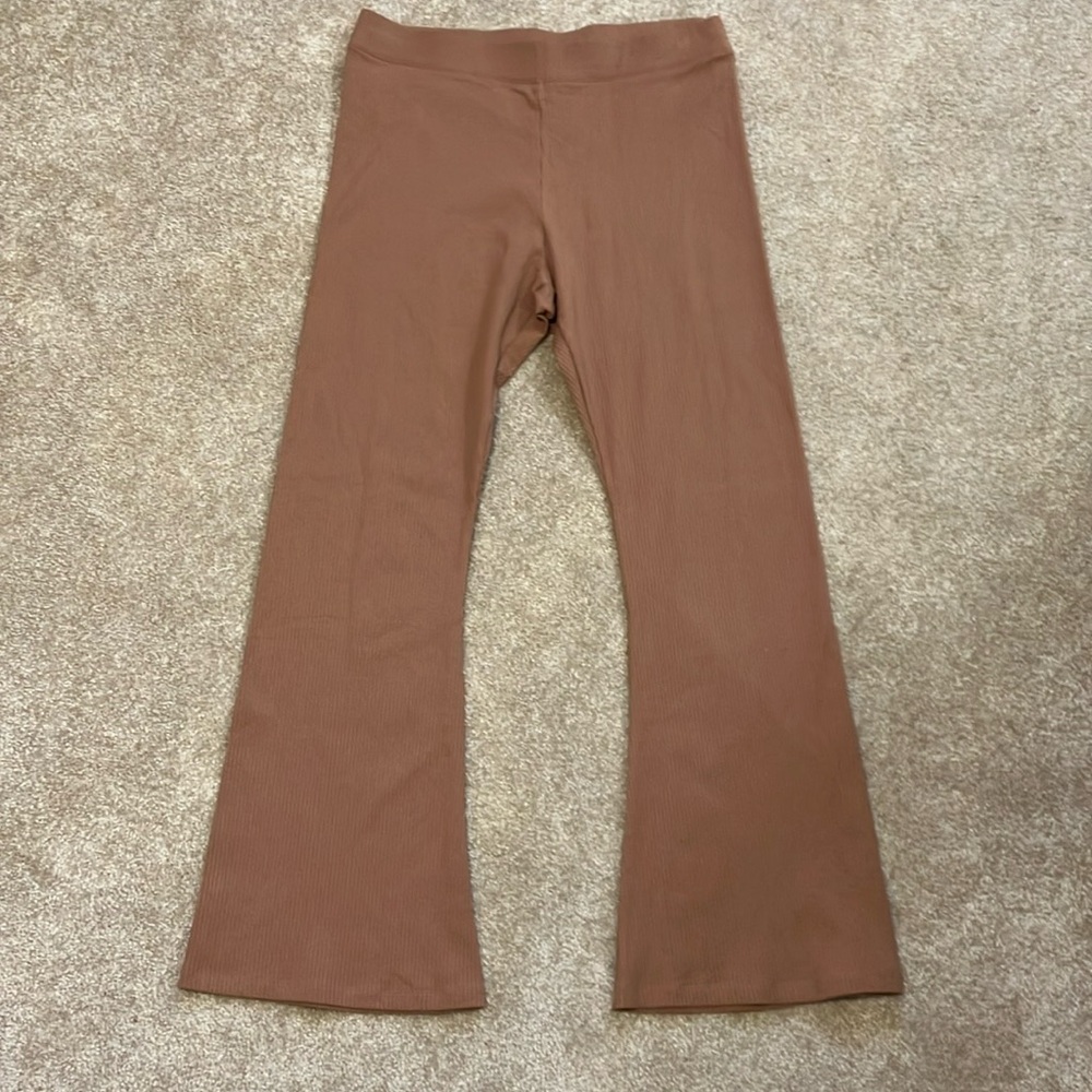 Victoria’s Secret pink boot, cut leggings